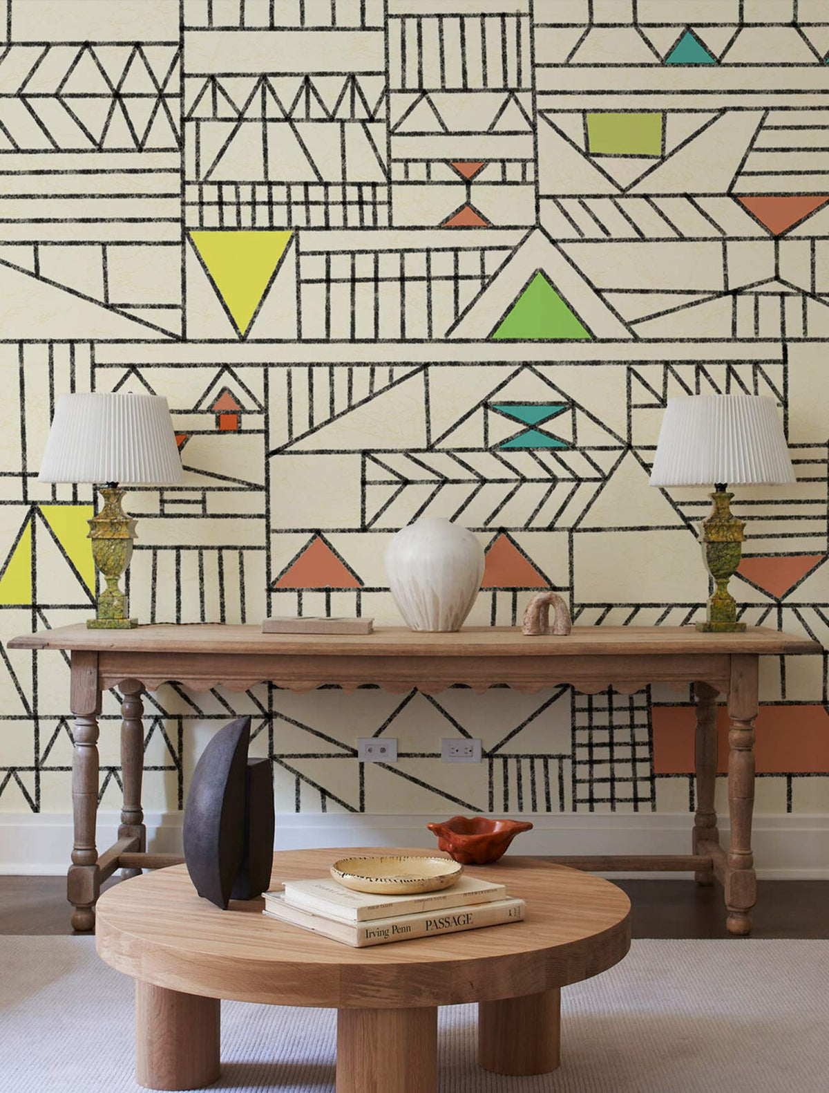 Geometric Retro Pastel Pattern Wallpaper with cream tones, wooden table, decorative lamps, round coffee table.