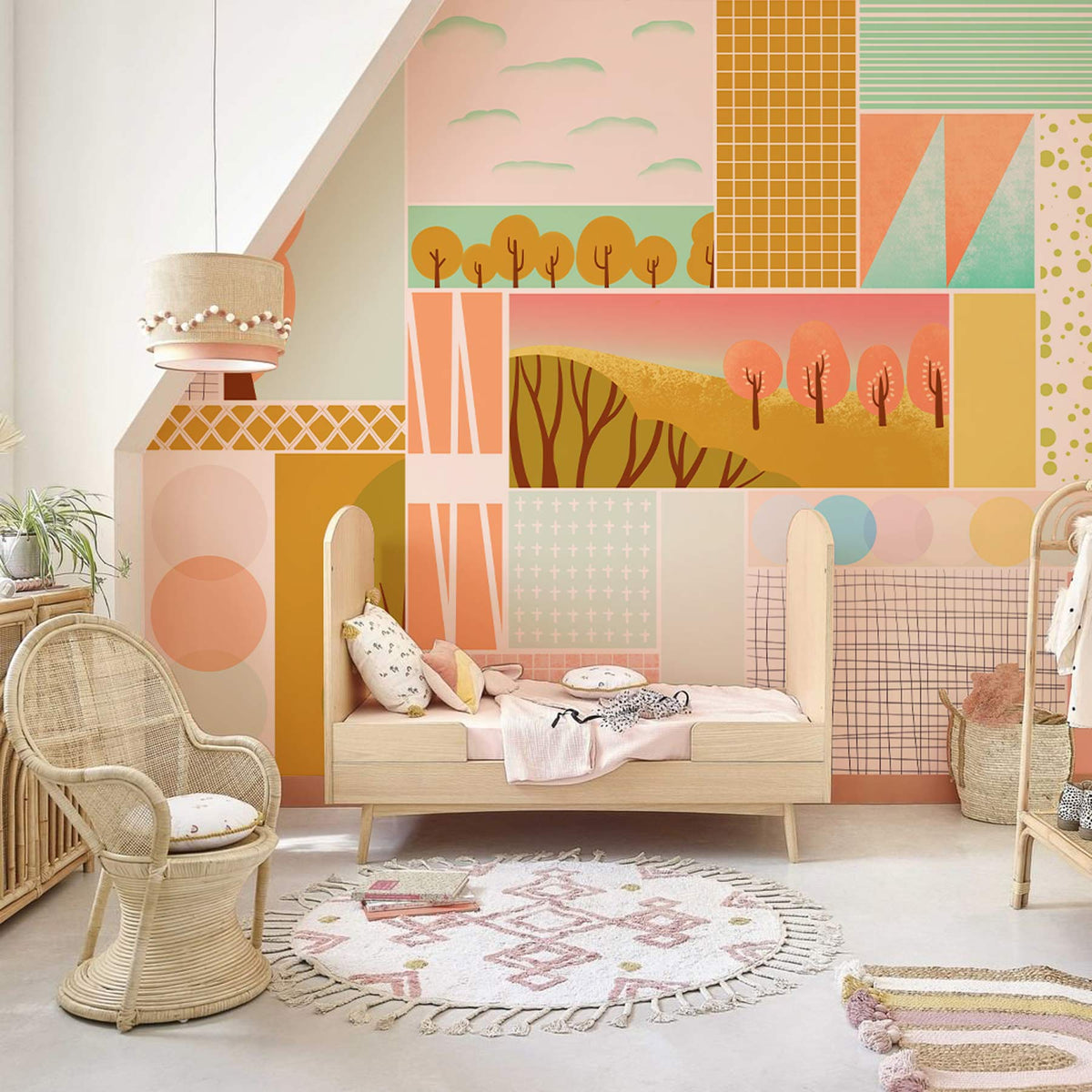 Pastel Geometric Landscape Mural Wallpaper in child's room, with wicker chair, rug, and neutral flooring.