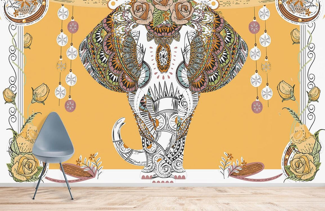 Exotic Elephant Boho Mural Wallpaper in earth tones, with grey chair, wood flooring, vibrant wall art.
