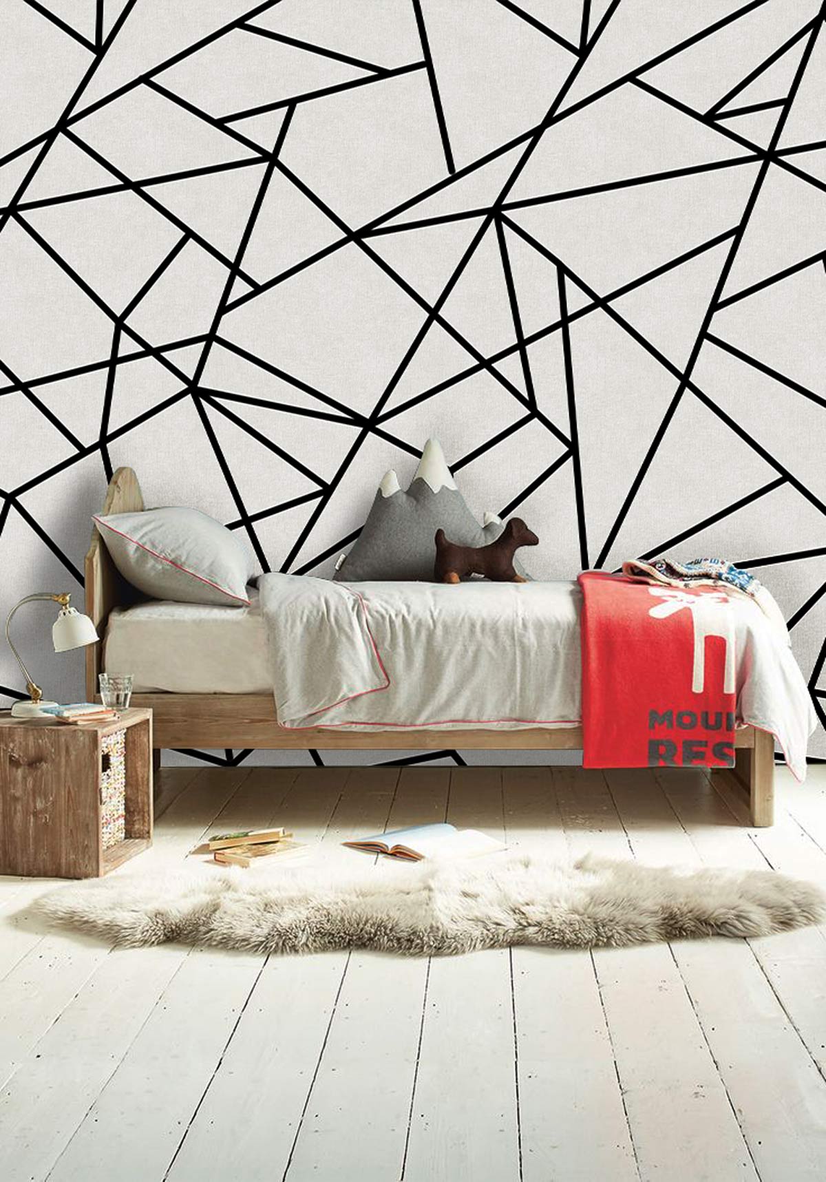 Monochrome geometric wallpaper in contemporary bedroom with wooden bed, white flooring, and abstract decor cushions.