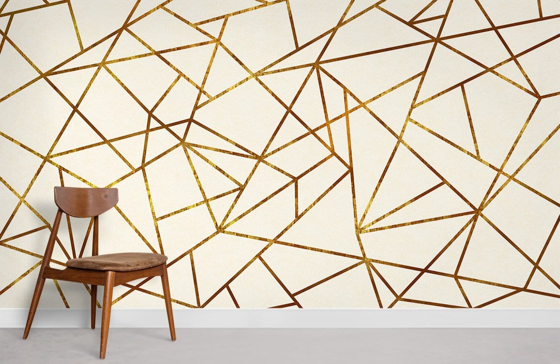 Contemporary gold geometric lines wallpaper, elegant design with wooden chair and light grey flooring.