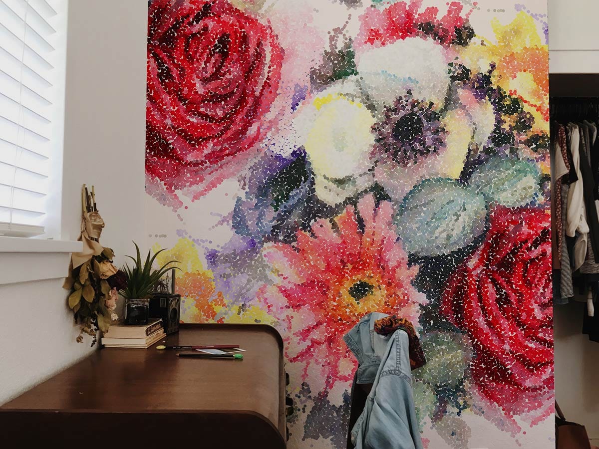 Vibrant floral wallpaper in bedroom with wooden desk, complementing colourful artistic watercolour bouquet design.