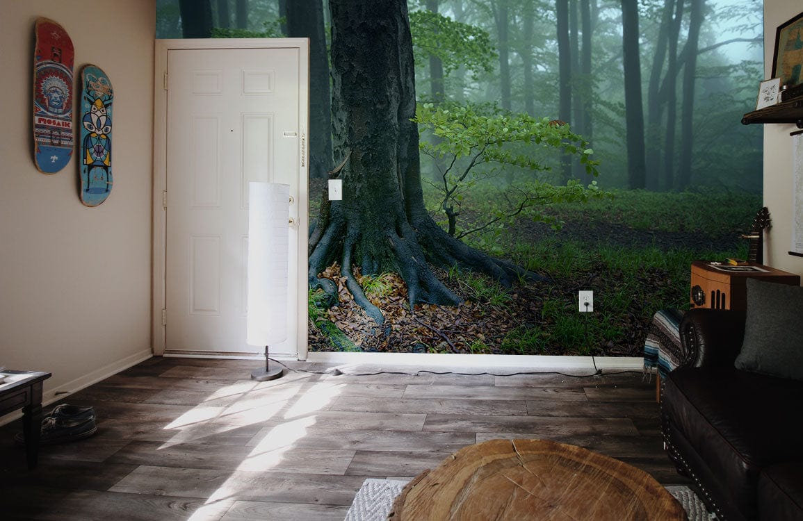 Enchanted forest mural wallpaper in living room with wooden flooring, leather sofa, and skateboard decor.