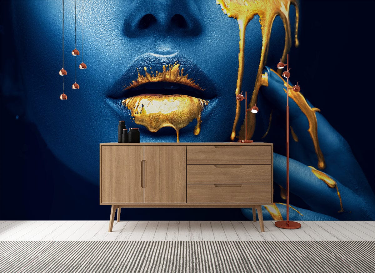 Elegant Blue and Gold Drip Art Mural Wallpaper with wooden sideboard and stylish pendant lighting.