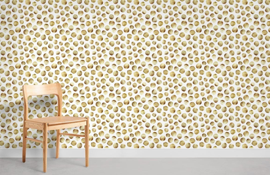 Golden honeycomb patterned wallpaper with light wood chair on grey flooring in modern room setting.
