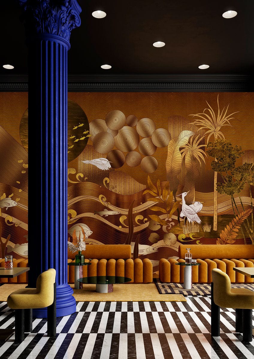 Golden nature-inspired mural wallpaper with herons, fish; mustard sofa, striped flooring, bold blue column.
