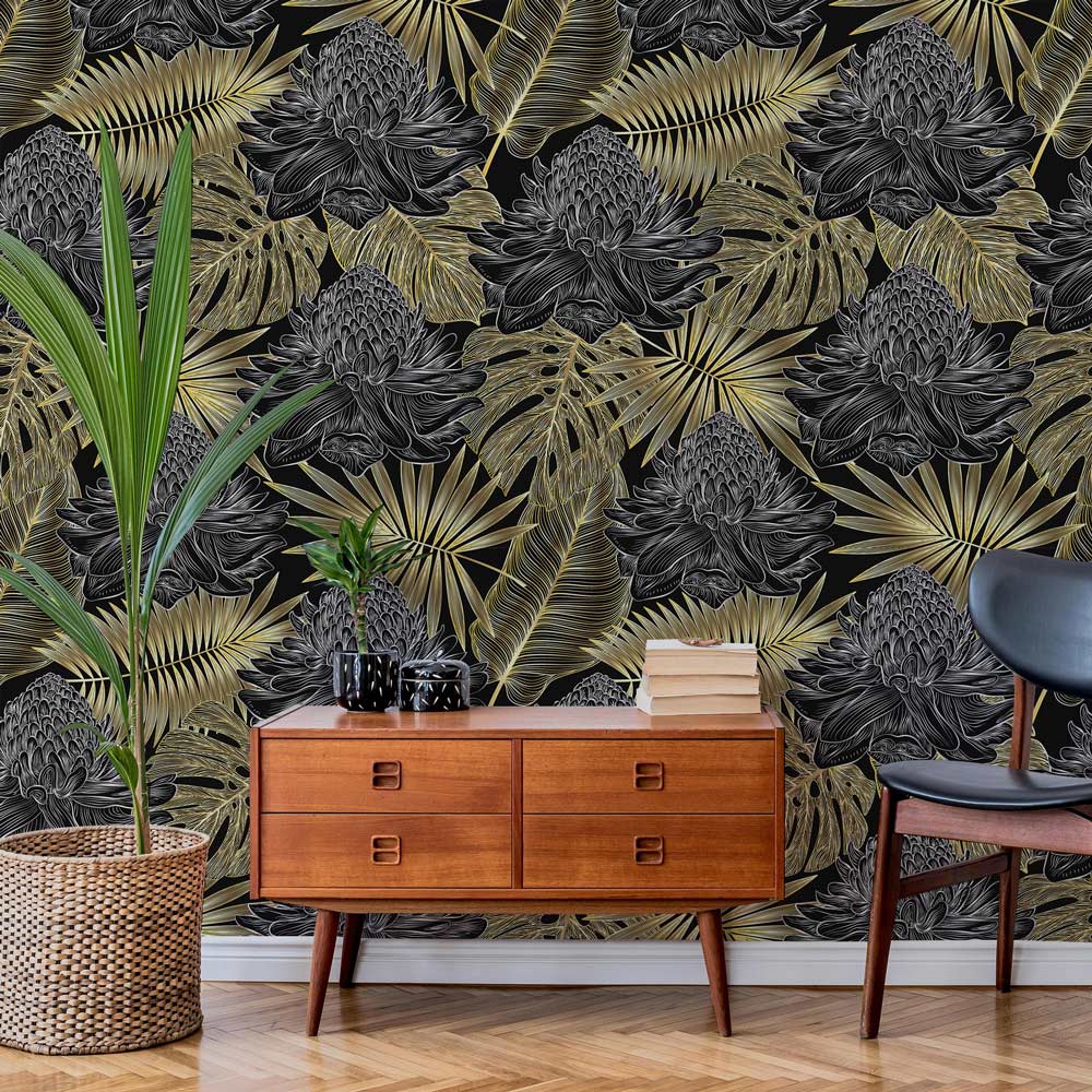 Luxurious black gold floral wallpaper in living room with mid-century wood sideboard and green plant.
