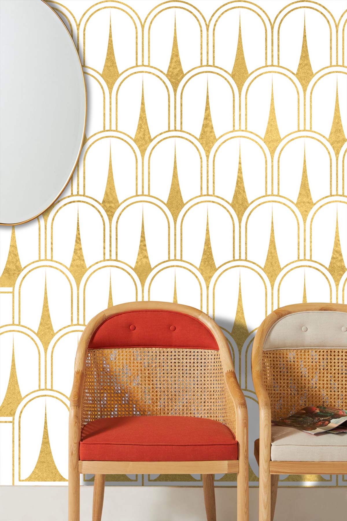 Art Deco gold geometric wallpaper with red and beige chairs, oval mirror, elegant interior design.