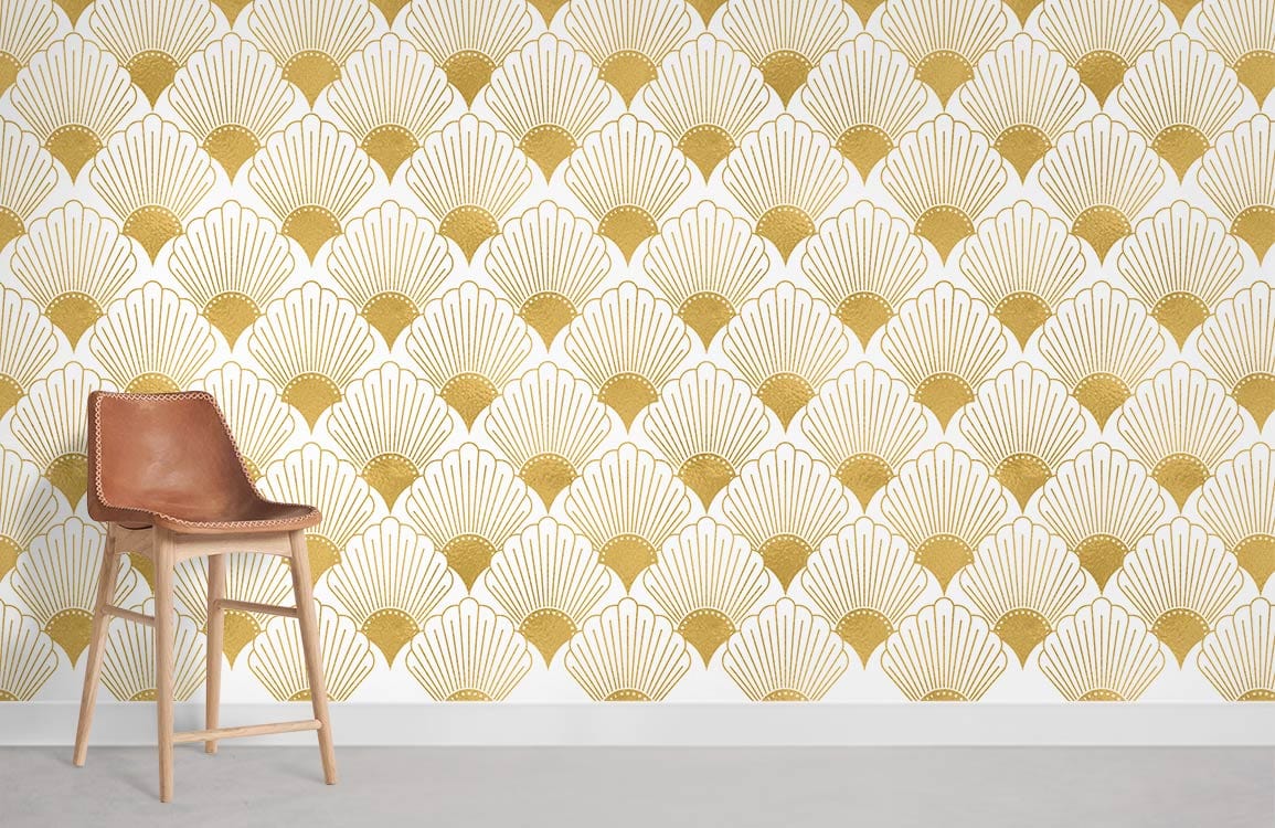 Golden Art Deco fan pattern wallpaper; vintage geometric style decor with modern brown chair, light flooring.