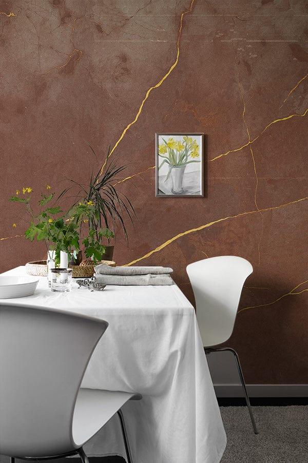 Luxurious brown marble wallpaper with gold veins; elegant dining room furniture includes white chairs and tablecloth.