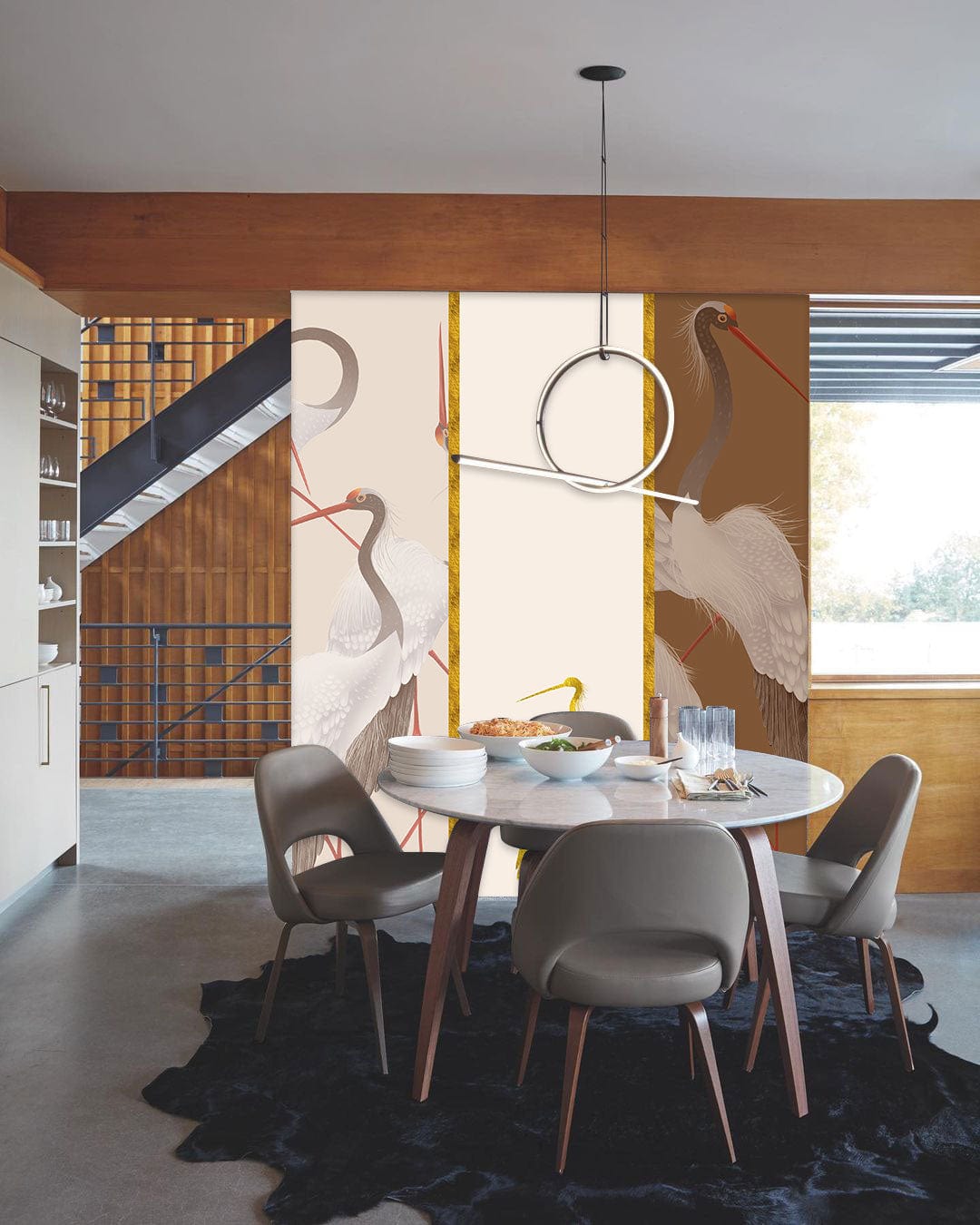 Elegant Crane Design Mural Wallpaper in dining room with modern chairs, round table, and pendant light.