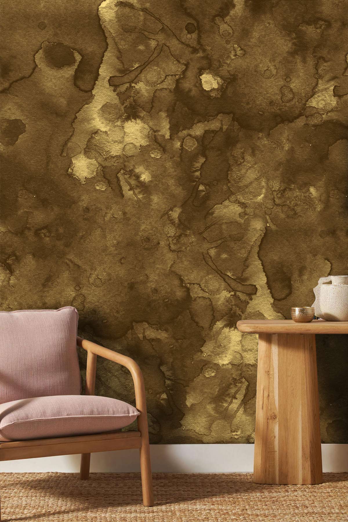 Rustic watercolour wallpaper with earthy tones, light wood table, and pink armchair for elegant decor.