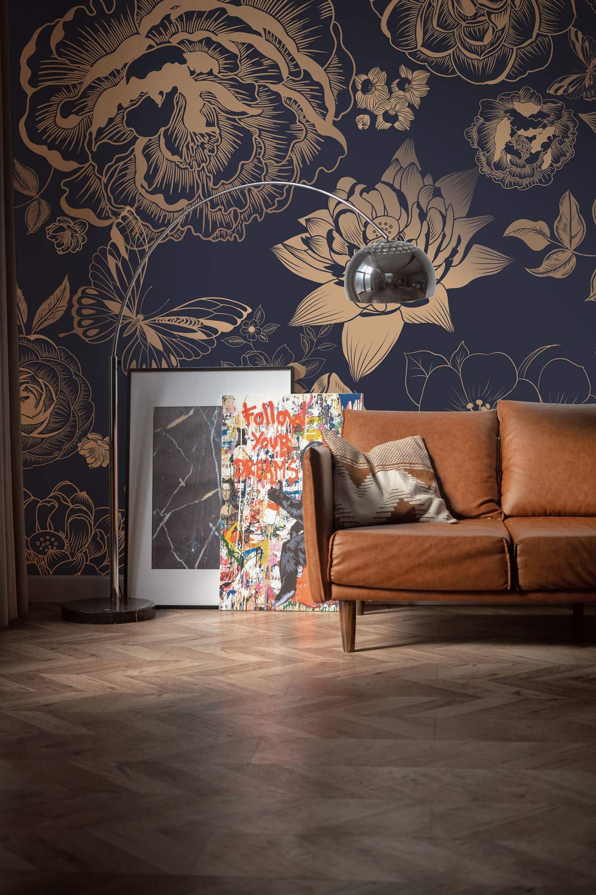 Luxurious gold floral damask wallpaper, navy background, brown leather sofa, parquet flooring, stylish decor.