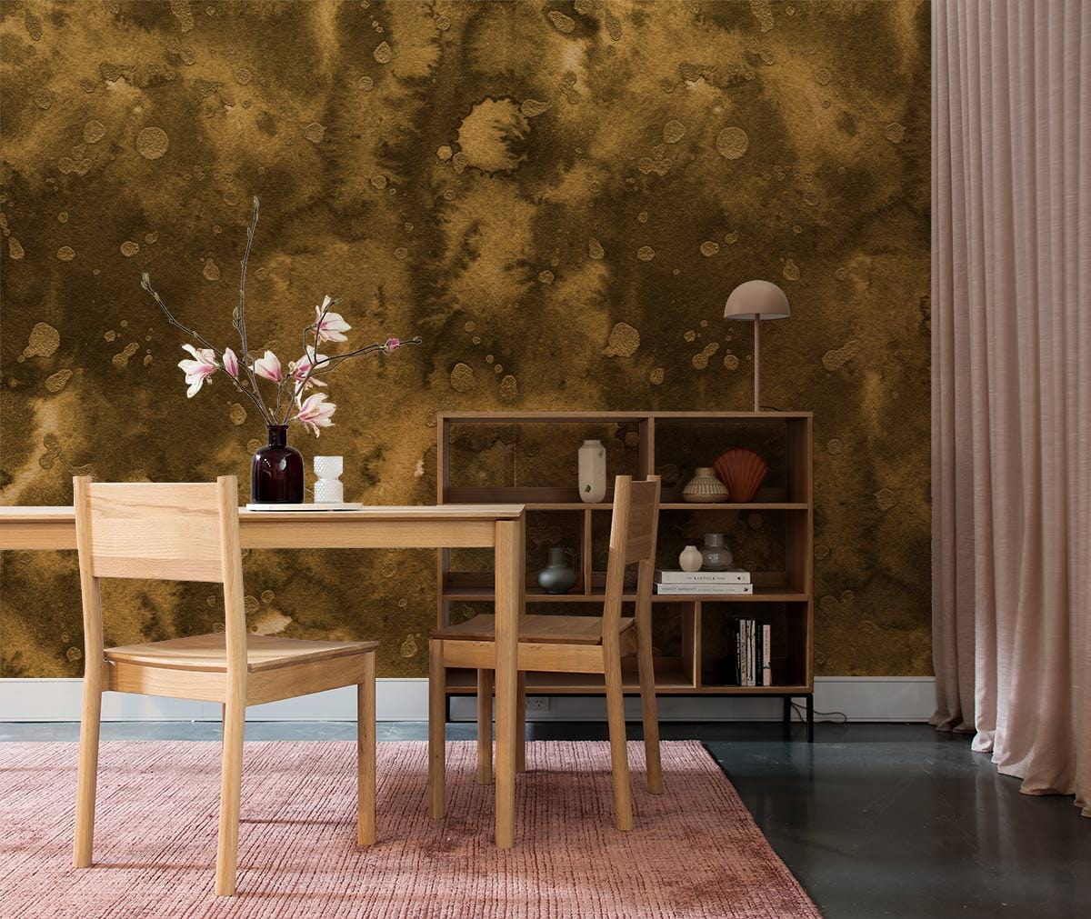 Rustic Earthy Tones abstract wallpaper, cosy dining area, wooden furniture, pink rug, and concrete flooring.