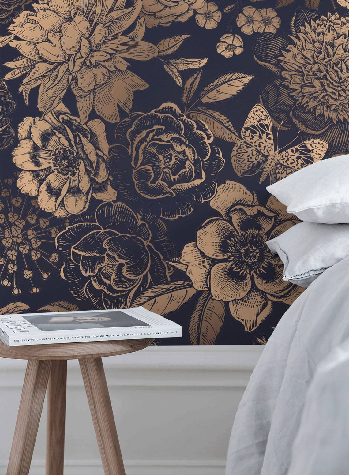 Luxurious floral damask navy wallpaper, elegant white bedroom setting, contemporary wooden side table.