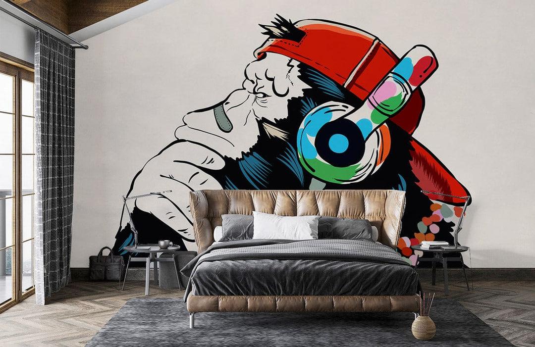Modern urban ape with headphones wall mural, grey bed, wooden flooring, contemporary bedroom design.