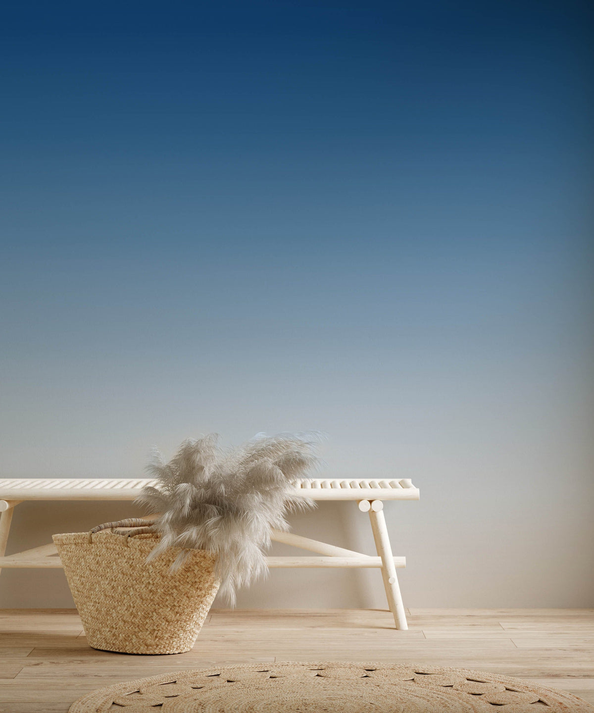 Blue gradient ombre wallpaper with white bench, light wood flooring in minimalist room design.