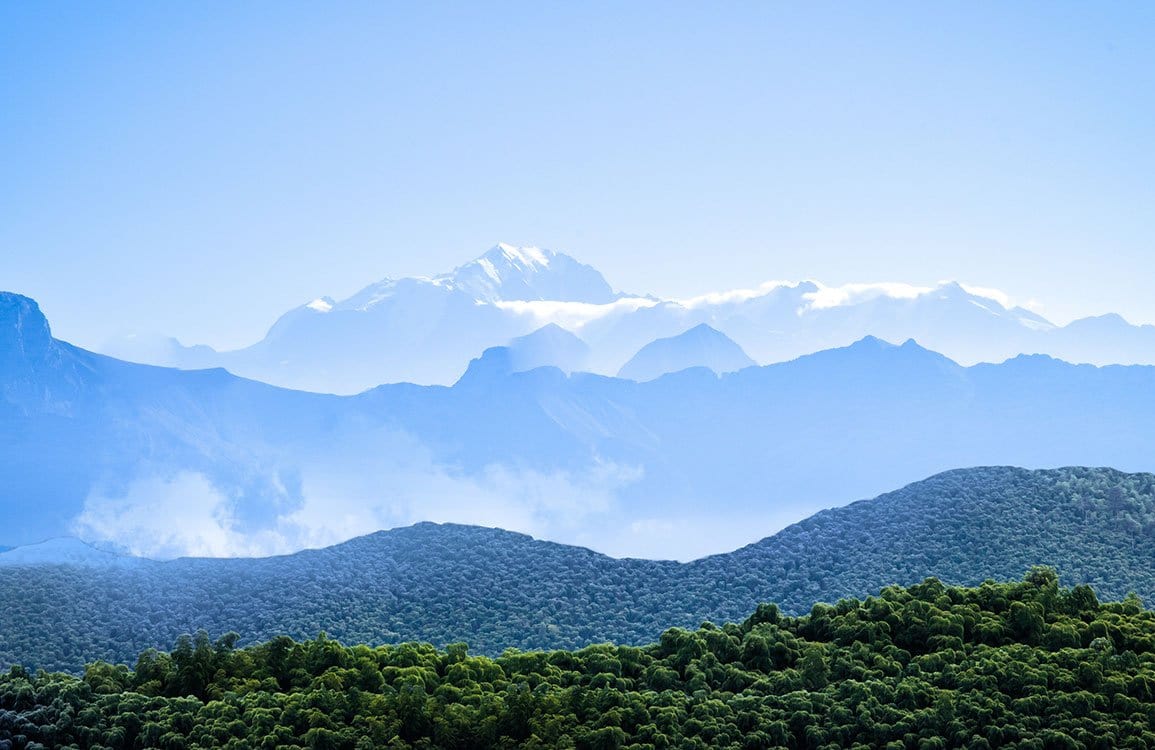 Tranquil Mountain Vista Scenic Mural Wallpaper in Soothing Blue and Green Tones