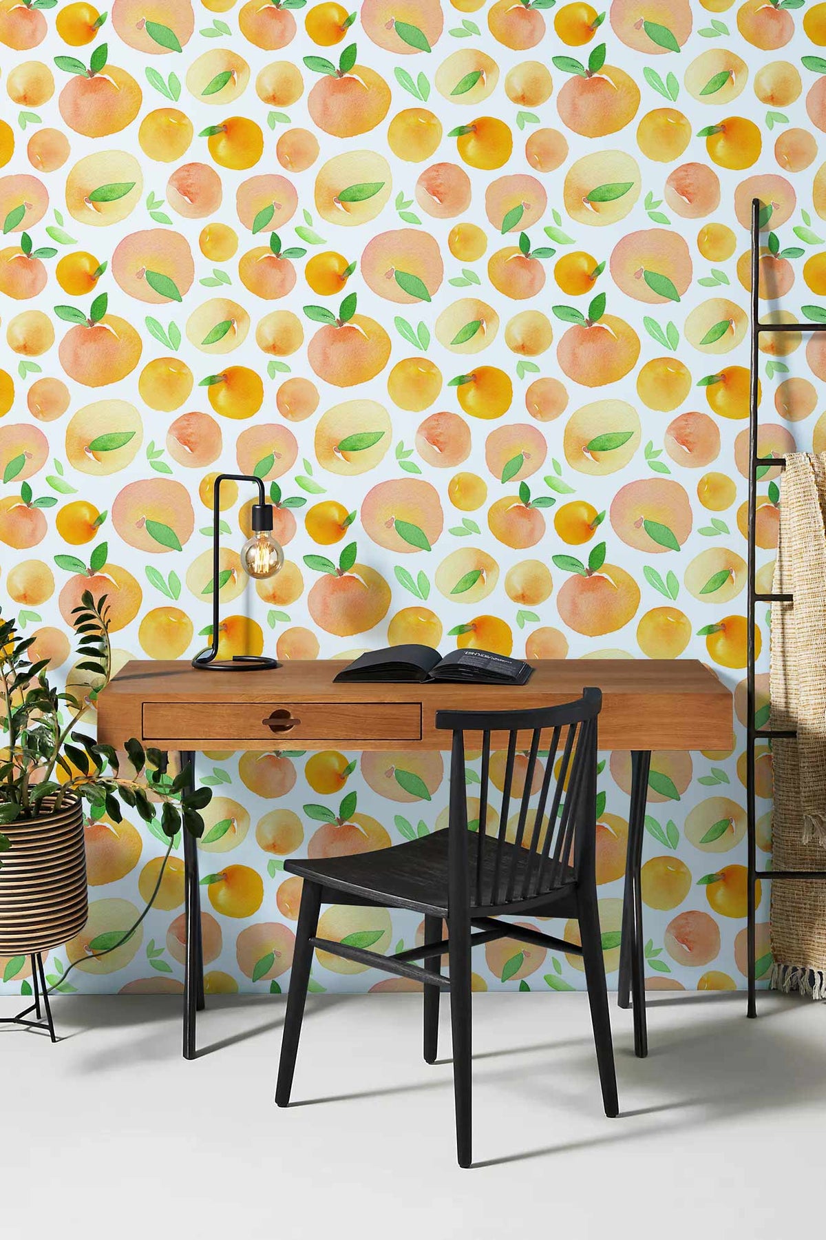 Peachy Orange Fruit Pattern Mural Wallpaper featuring wooden desk, black chair, stylish office setting.