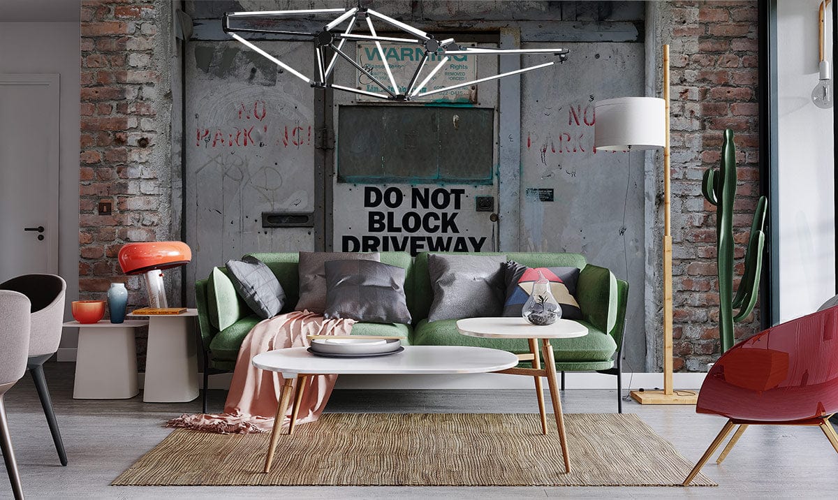 Urban Industrial brick and steel mural wallpaper with grey tones, green sofa, modern style room.