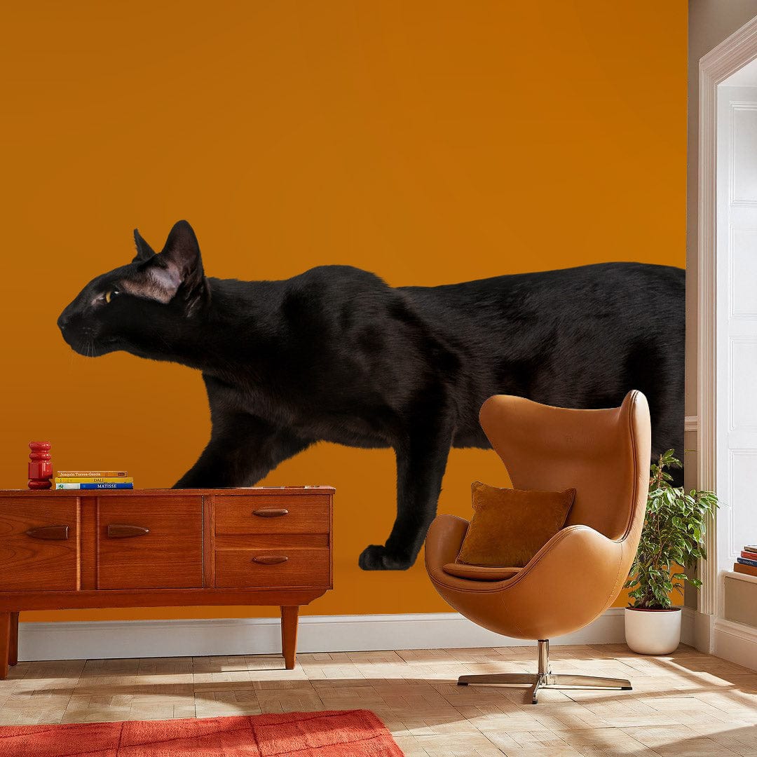 Mystical Black Cat Silhouette Bold Wallpaper with Retro Sideboard, Mid-Century Chair, and Warm Mustard Wall.