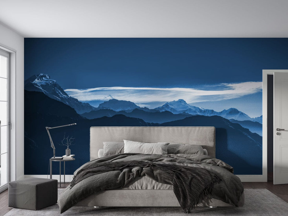 Serene Twilight Blue Mountain Range Mural in bedroom with grey bed, elegant wall Décor, modern style.