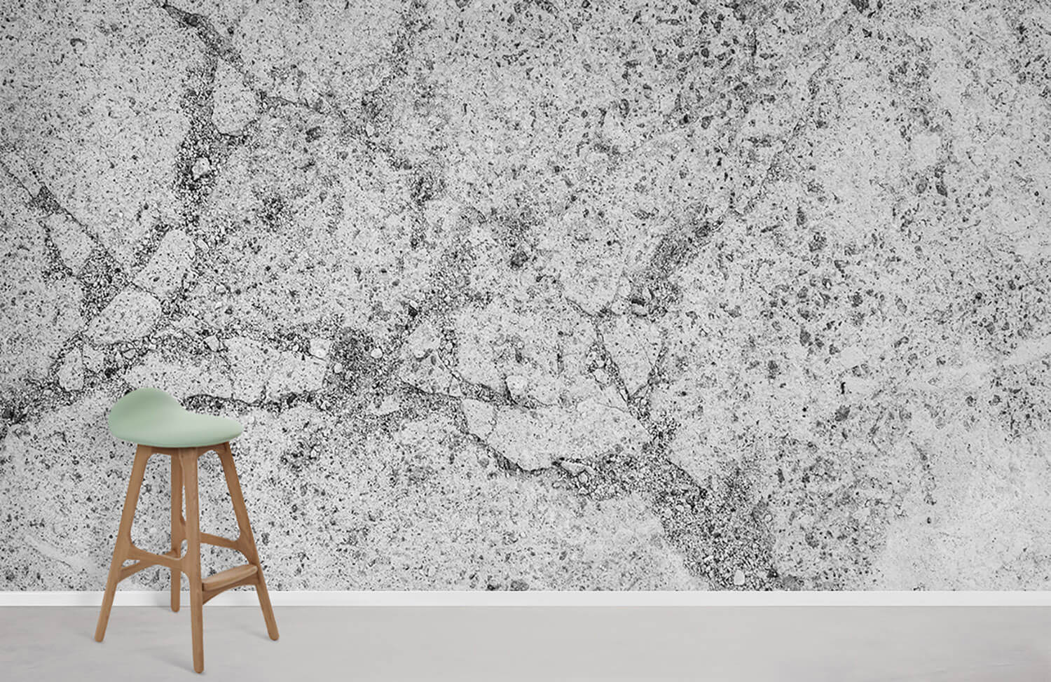 Elegant grey marble textured wallpaper with modern stool on light flooring in contemporary interior design.