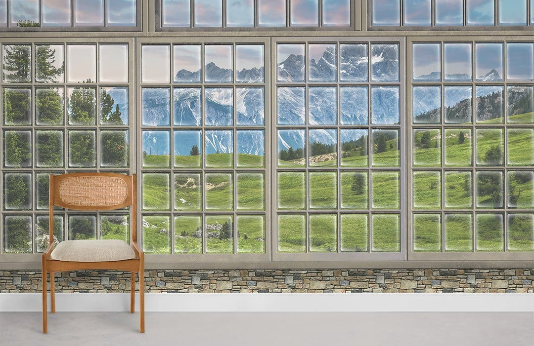 Panoramic mountain view mural wallpaper in room with wooden chair and stone accent wall. Scenic landscape.