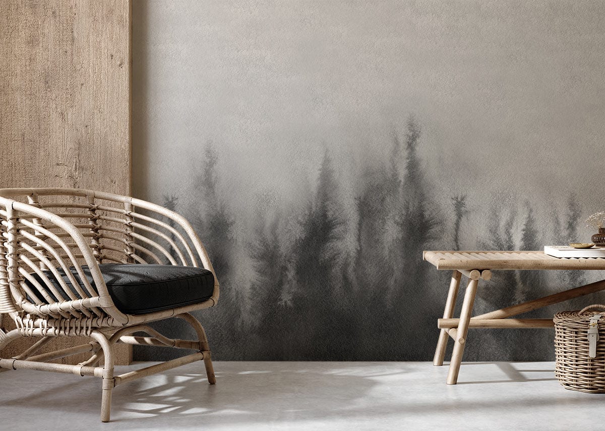 Misty Forest grey mural wallpaper with rattan chair, wooden table, concrete flooring in tranquil room setting.