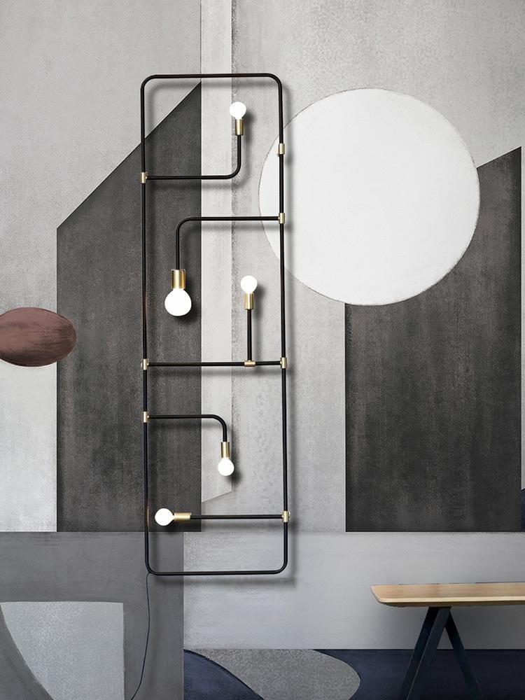 Monochrome geometric mural wallpaper in contemporary grey with artistic design, modern wall lamp, wooden bench.