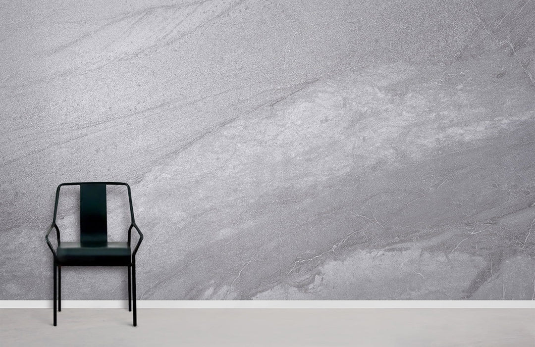 Elegant grey marble wallpaper in modern room with black chair and light grey flooring.