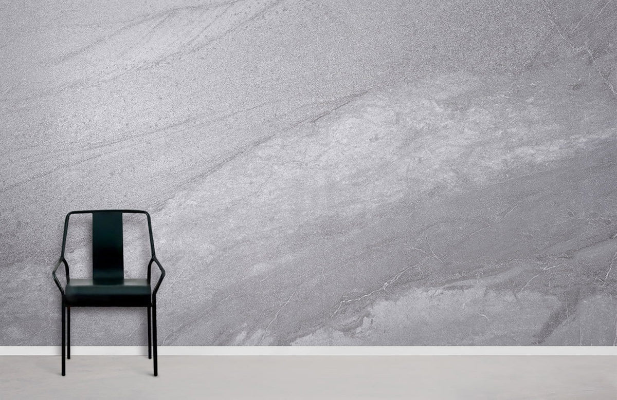 Elegant grey marble wallpaper in modern room with black chair and light grey flooring.