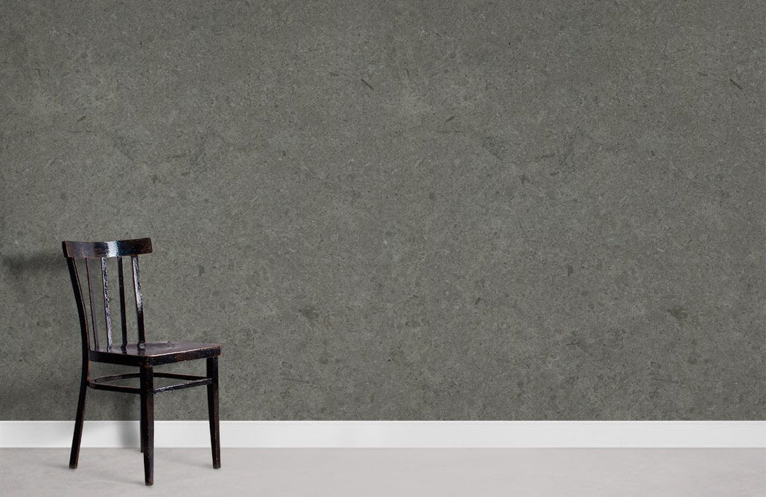Slate grey stone effect wallpaper, modern interior. Dark chair, light floor contrast.