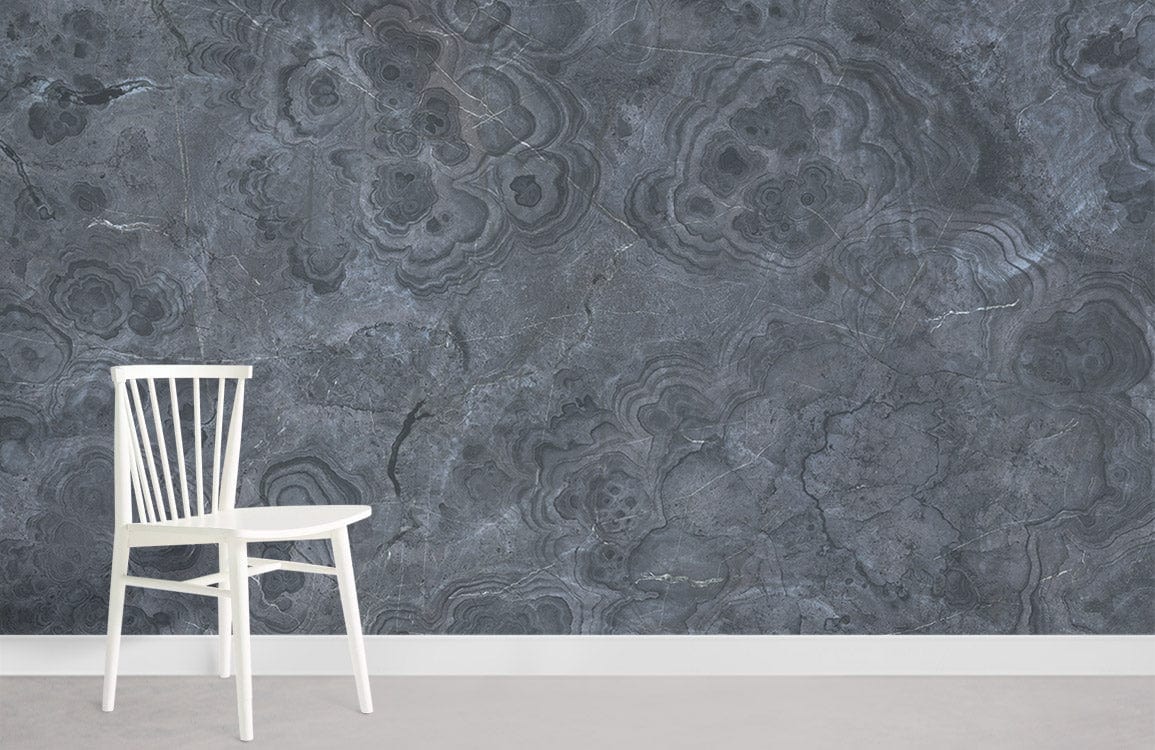 Elegant Charcoal Marble Texture Wallpaper with white chair and grey floor in a minimalist room.