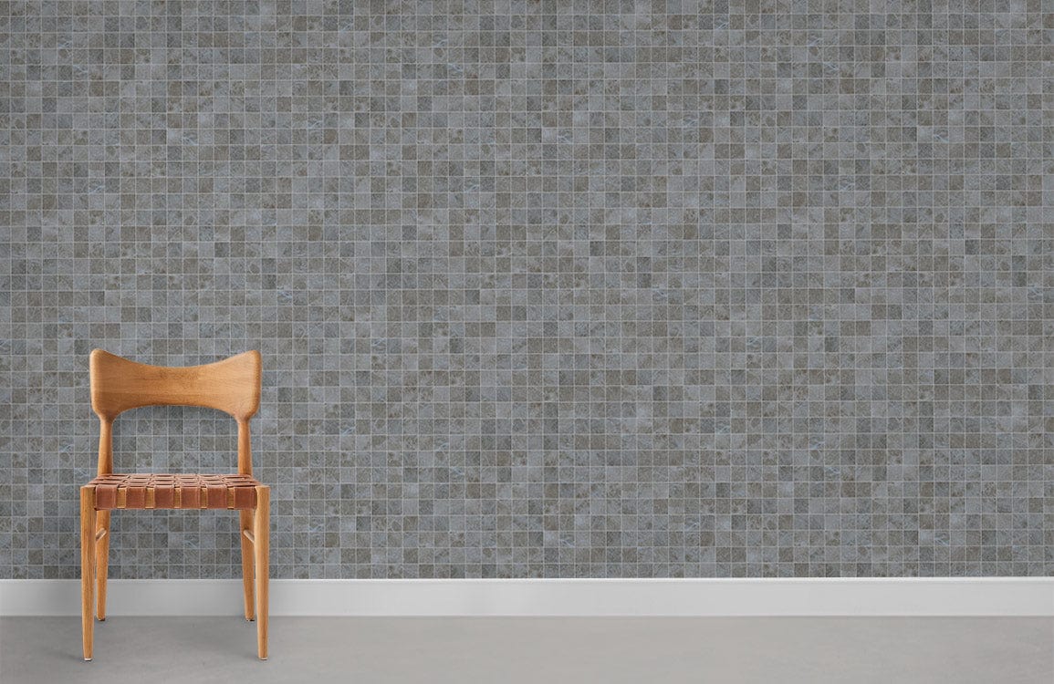 Elegant grey mosaic tile wallpaper with wooden chair on concrete flooring, modern interior decor style.