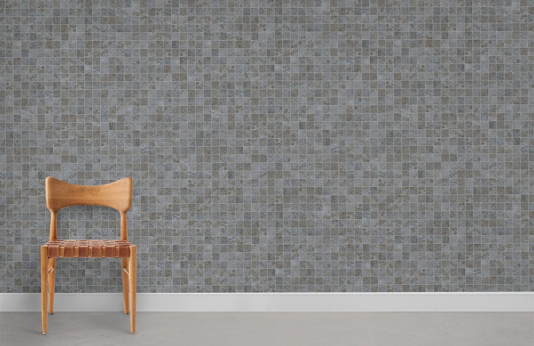 Elegant grey mosaic tile wallpaper with wooden chair on concrete flooring, modern interior decor style.