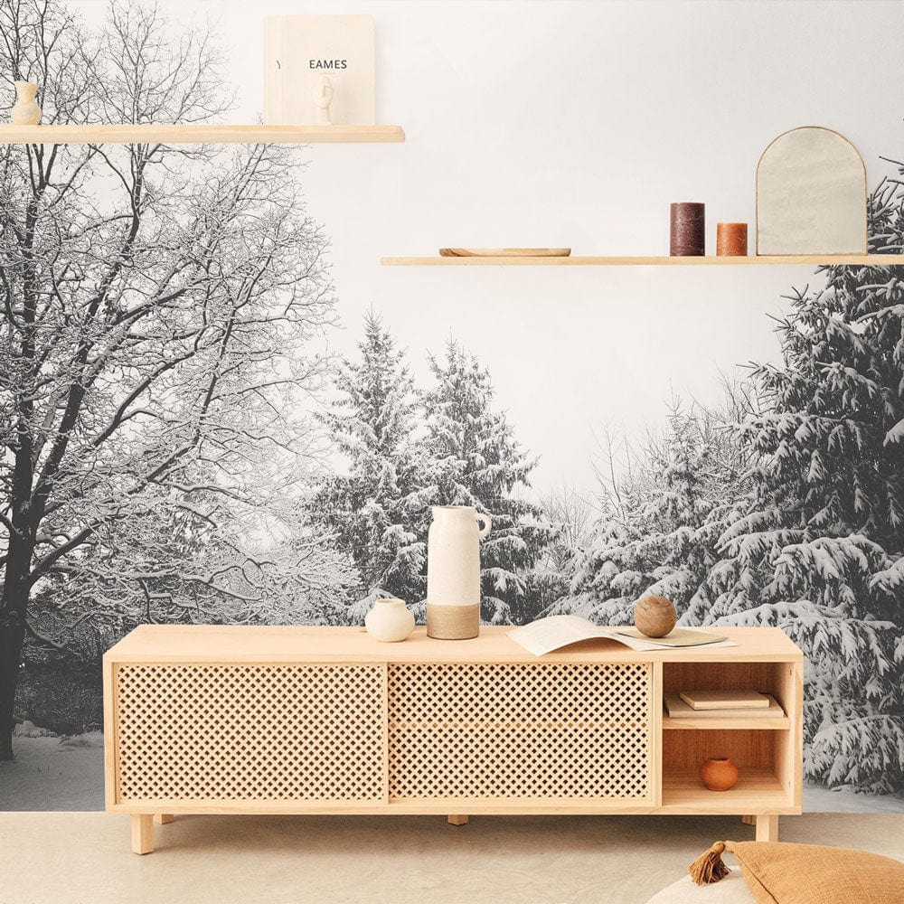 Winter Wonderland Black and White Forest Mural Wallpaper, light wood sideboard, minimalist decor, neutral floor.