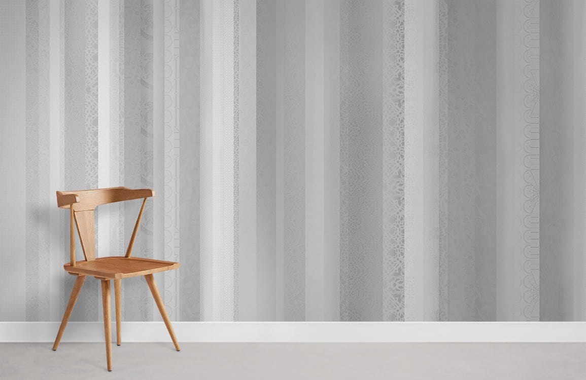 Wooden chair on grey striped wallpaper, placed on light carpeted flooring in a modern room setting.