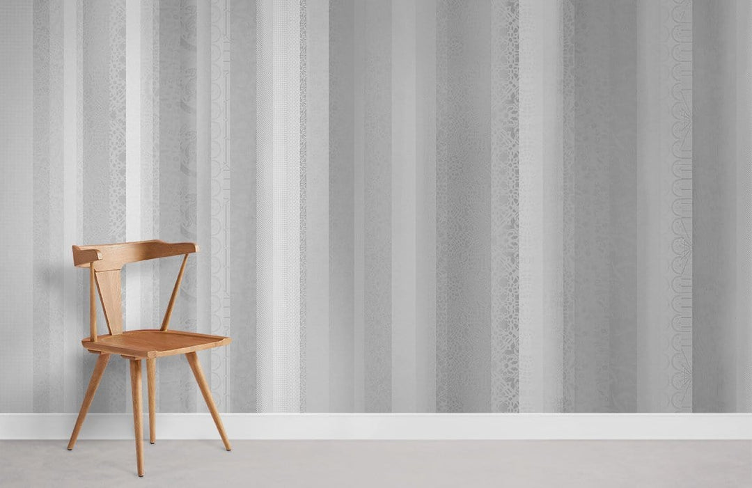 Wooden chair on grey striped wallpaper, placed on light carpeted flooring in a modern room setting.