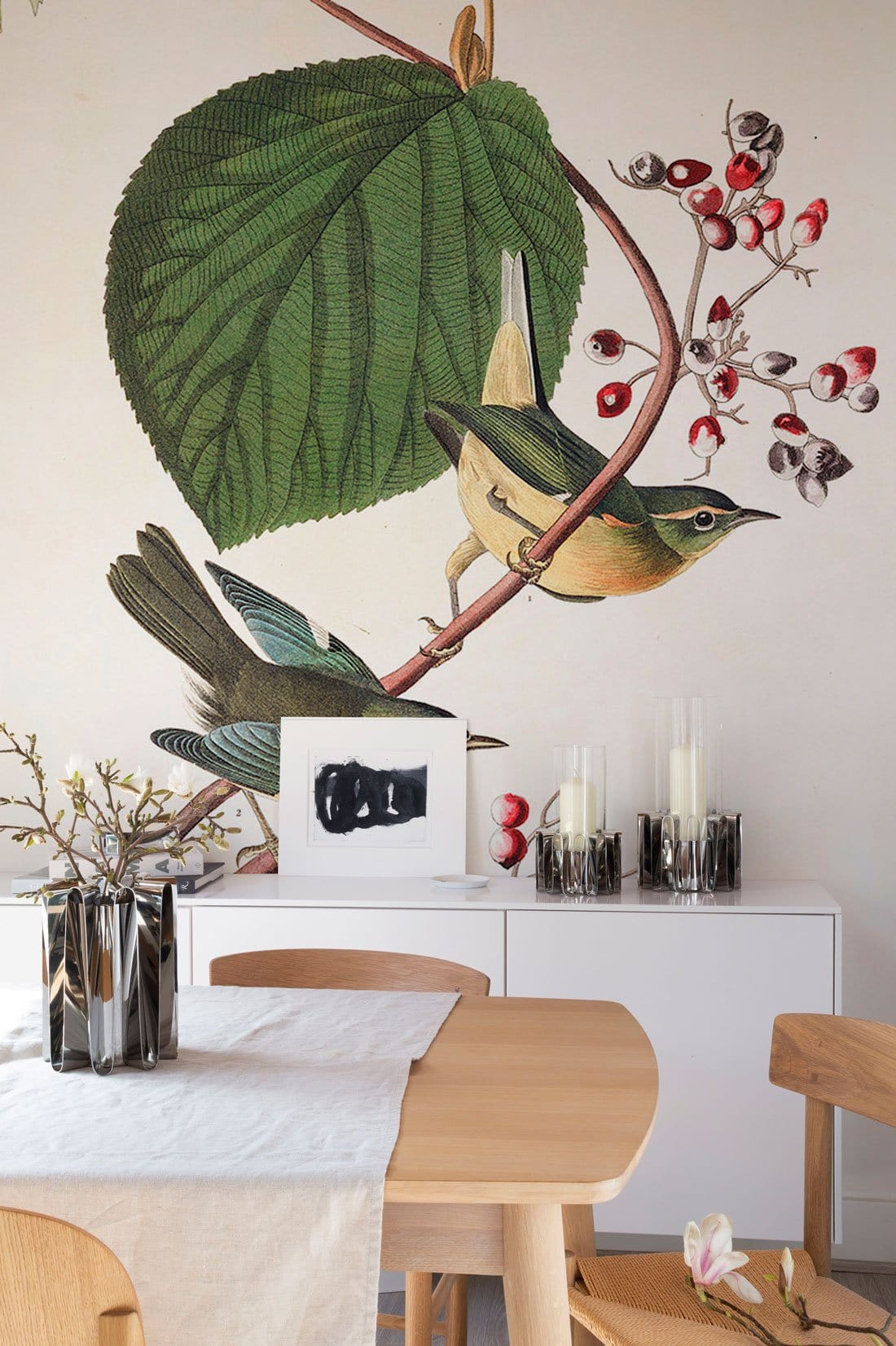 Vintage Botanical Birds Wallpaper with Green Leaves, Red Berries. Wooden dining set, white sideboard.