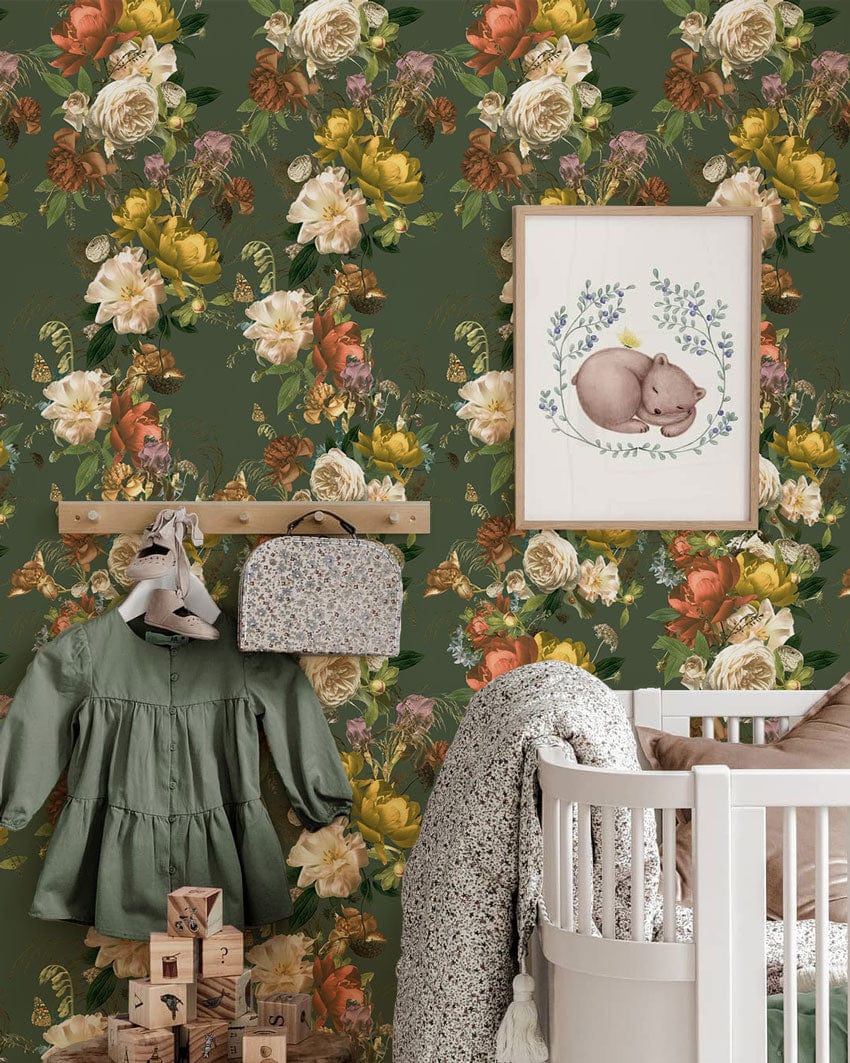 Vintage floral wallpaper, autumnal tones, nursery room, white crib, green coat, wooden hanger.