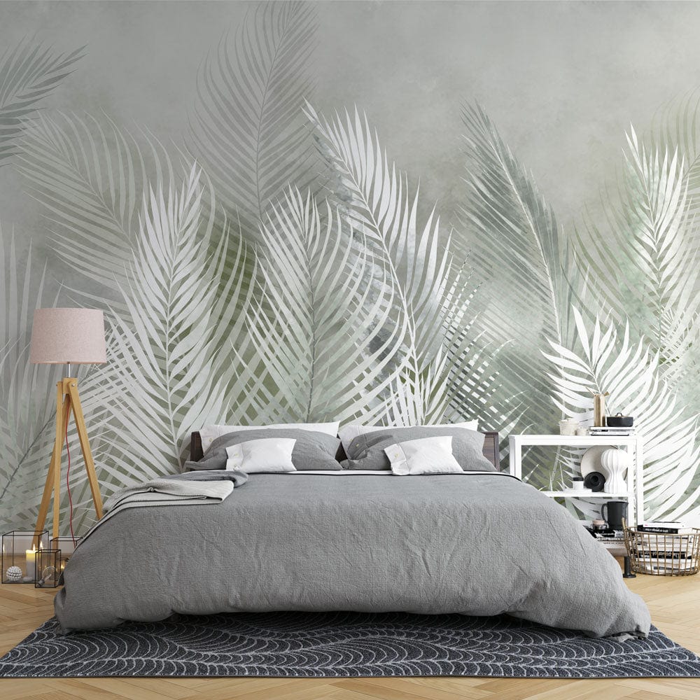 Tropical Misty Ferns Mural Wallpaper with grey bed, wooden flooring, and white shelves in bedroom.