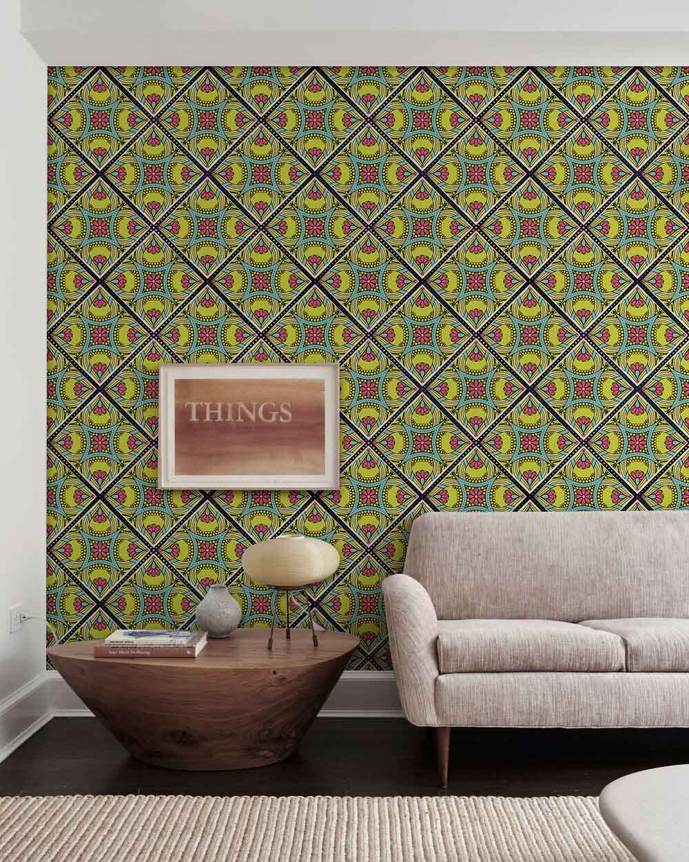 Vibrant wallpaper with geometric kaleidoscope pattern, light beige sofa, wooden coffee table, stylish lamp.