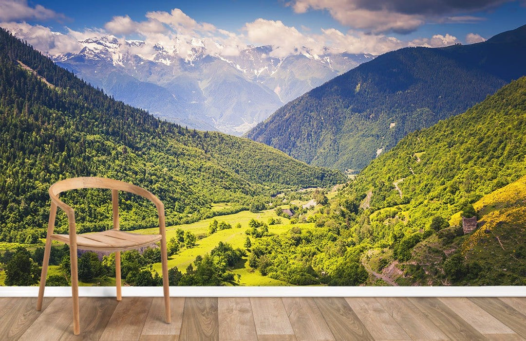 Scenic Mountain Valley Landscape Mural Wallpaper in living room, wooden chair, oak flooring.