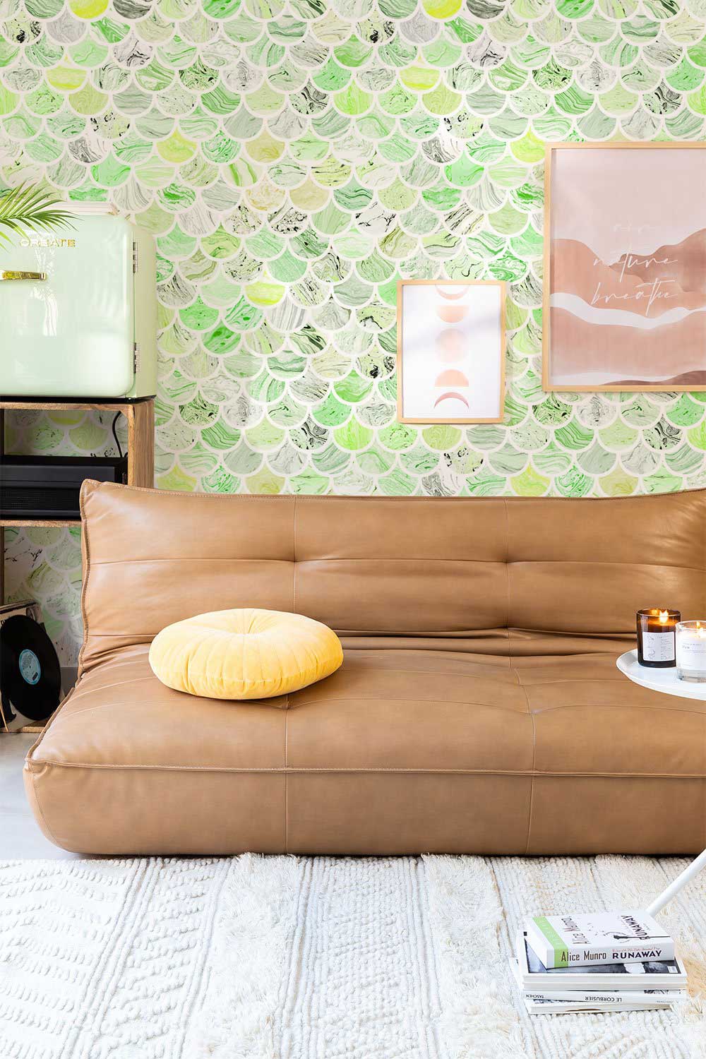Refreshing Citrus Green Scallop Wallpaper in a modern living room with tan leather sofa and artwork.