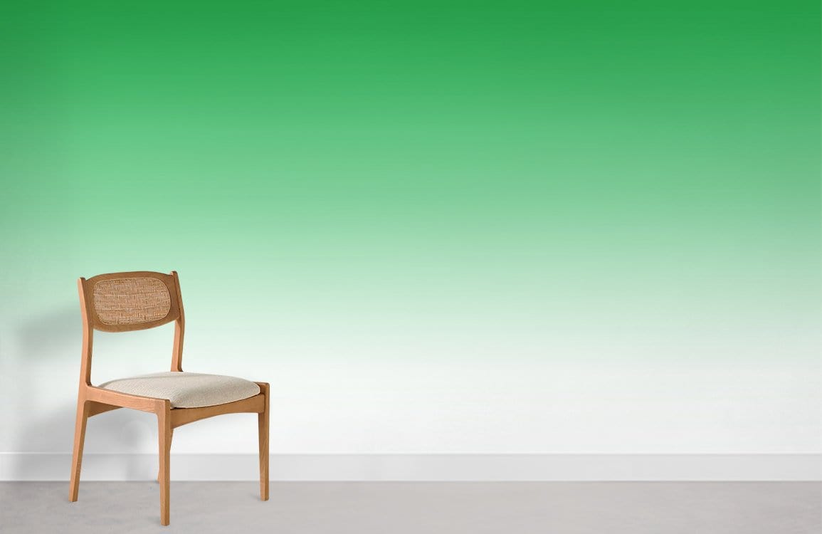 Vibrant green gradient wallpaper with wooden chair on light floor in modern UK interior.