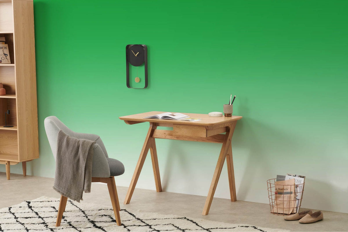 Vibrant green gradient wallpaper, oak desk, grey chair, modern living room, designer style UK.