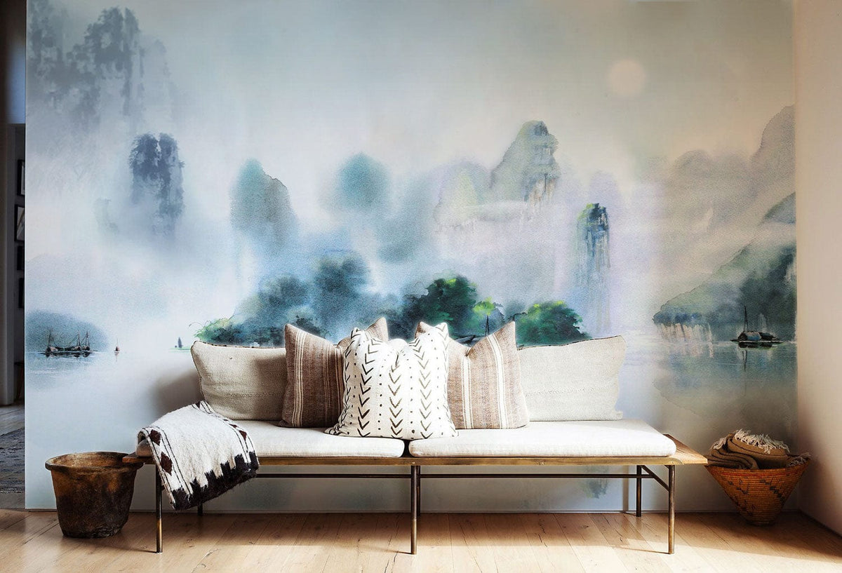 Serene Misty Mountain Watercolour Mural Wallpaper with beige sofa, wooden floor, and decorative cushions.