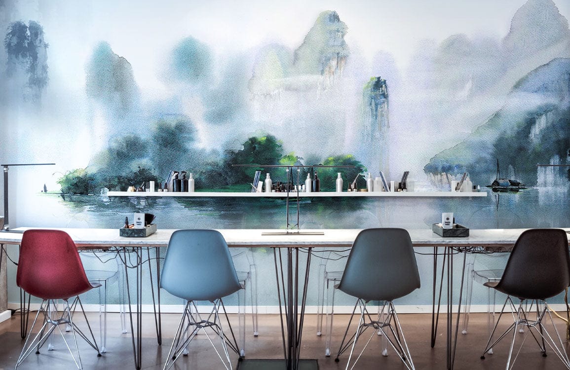 Serene Misty Mountain Watercolour Mural Wallpaper in blues, with modern chairs in an office setting.