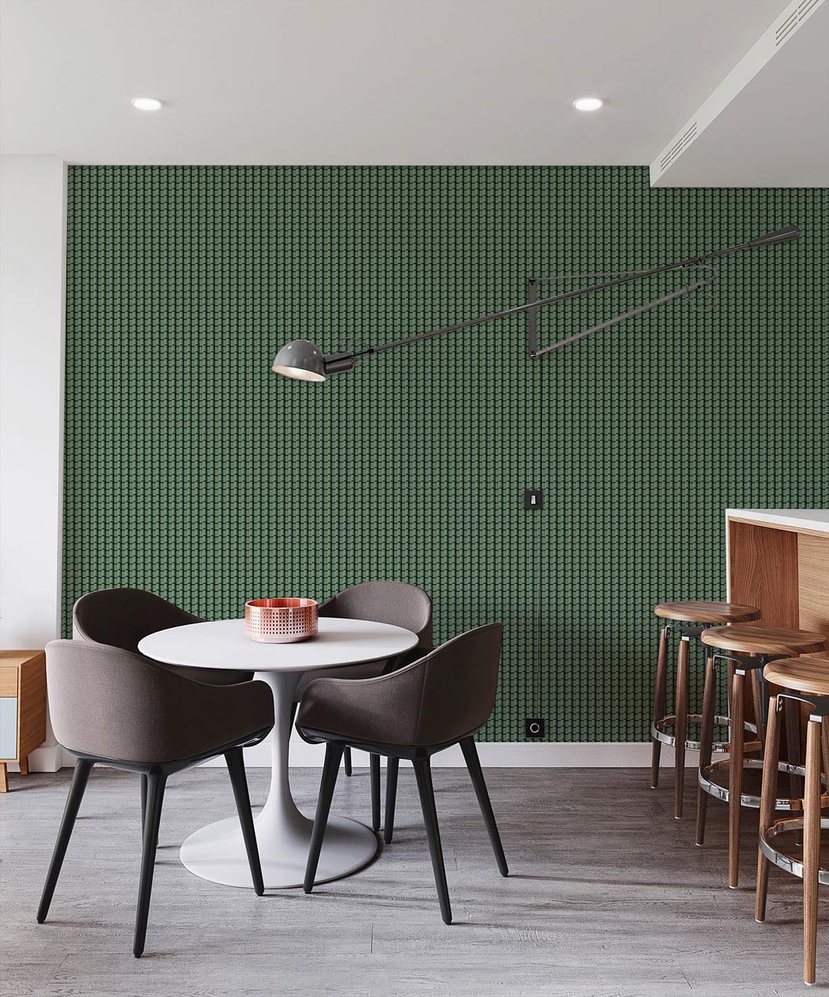 Elegant forest green geometric wallpaper in dining room with round table, grey chairs, wooden flooring.